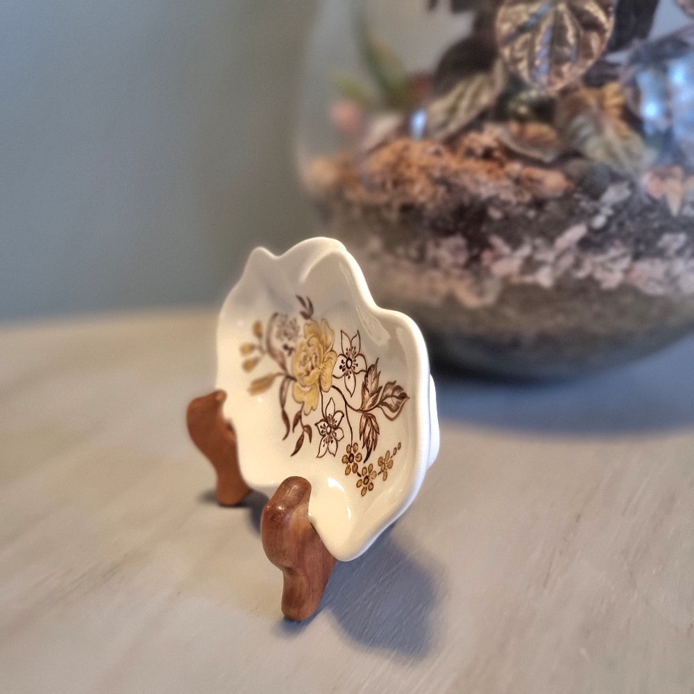 Vintage hand painted ceramic trinket dish by Lyn Bone with yellow rose and floral design on wavy edged oval dish
