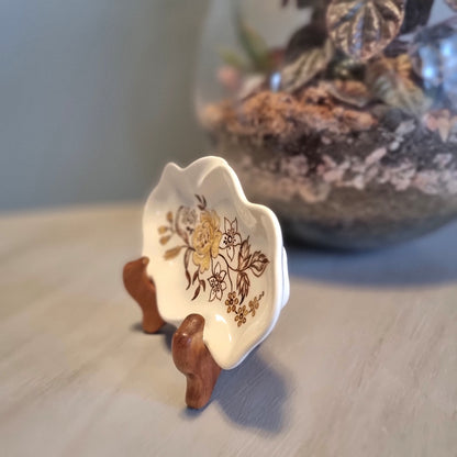 Vintage hand painted ceramic trinket dish by Lyn Bone with yellow rose and floral design on wavy edged oval dish
