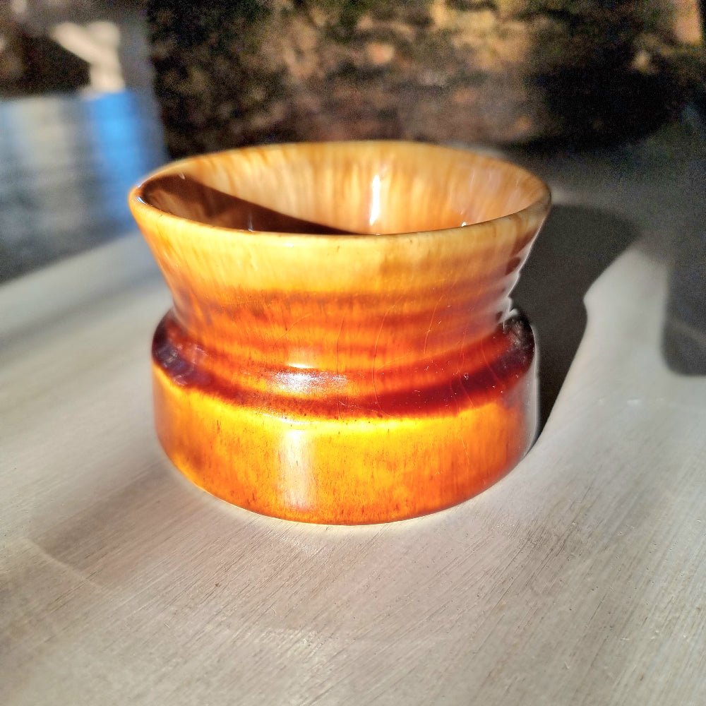 Crown Lynn 1257 honey glaze bowl with flared rim and banded base