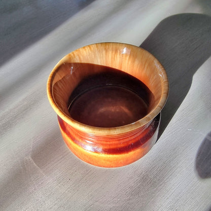 Crown Lynn 1257 honey glaze bowl with flared rim and banded base
