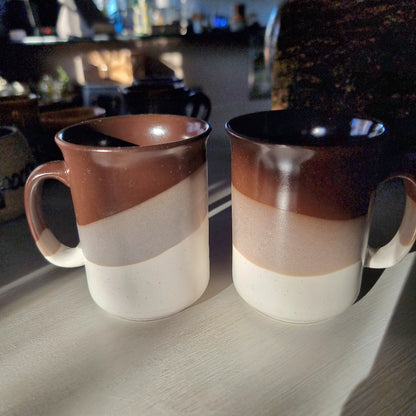 Pair of vintage drip glaze mugs in brown, tan and cream