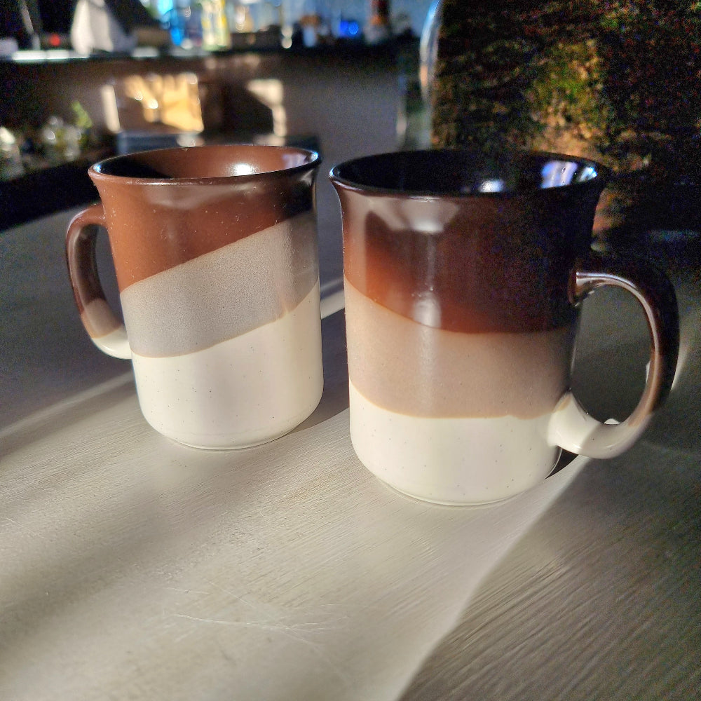 Pair of vintage drip glaze mugs in brown, tan and cream