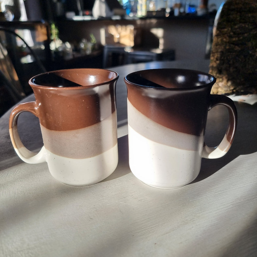 Pair of vintage drip glaze mugs in brown, tan and cream