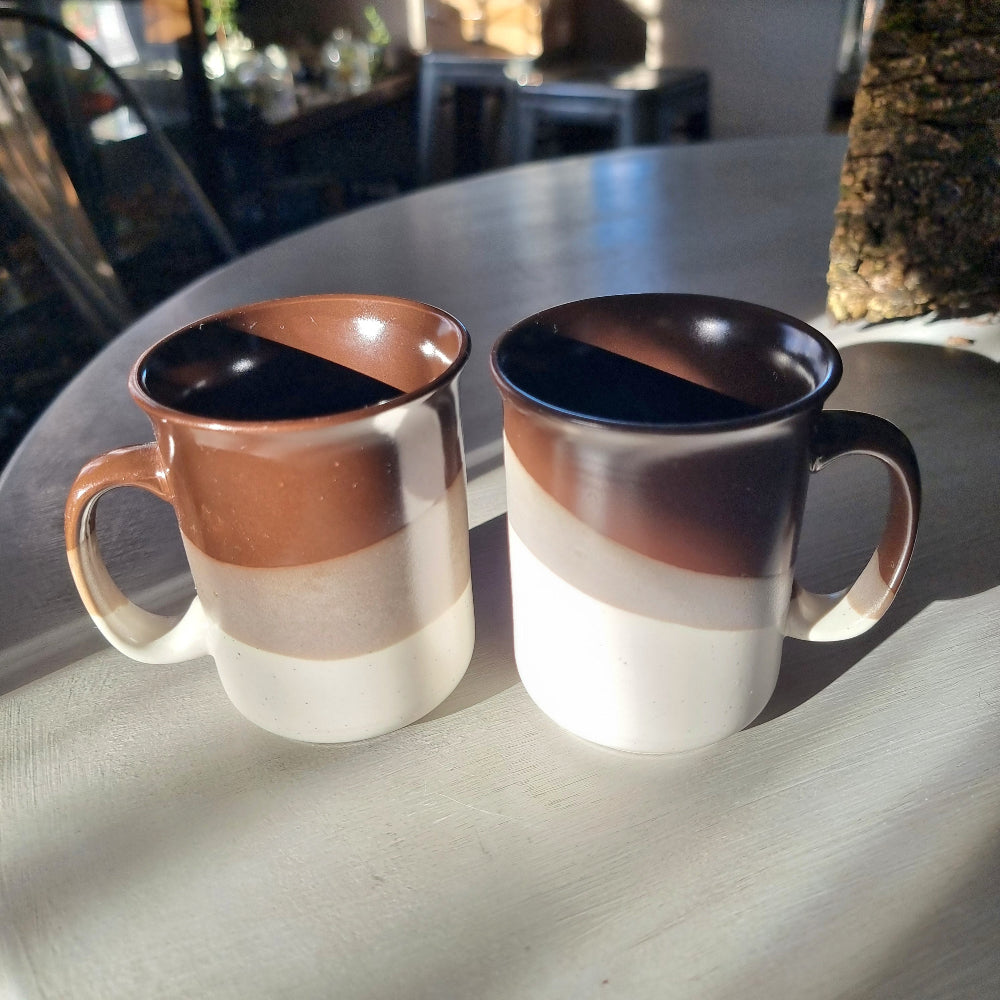 Pair of vintage drip glaze mugs in brown, tan and cream