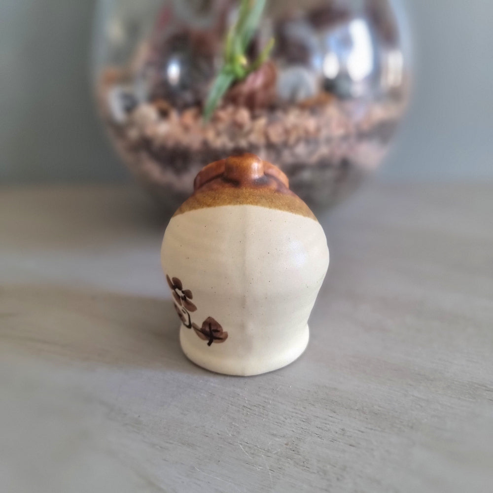 Vintage cottage-style ceramic salt pig or honey pot with brown glaze and hand-painted floral design