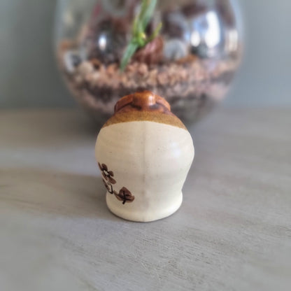Vintage cottage-style ceramic salt pig or honey pot with brown glaze and hand-painted floral design