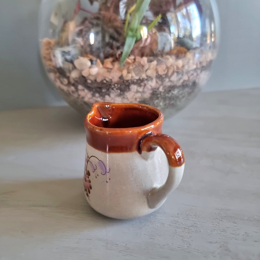 Vintage cream jug with brown glazed rim and pink floral design