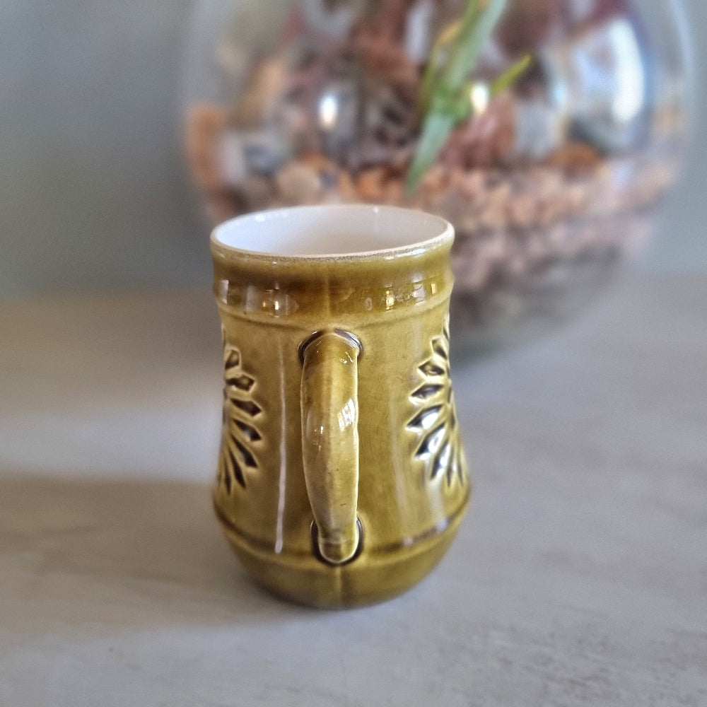 Vintage green Celtic Irish Fine Earthenware mug with pierced sunburst design