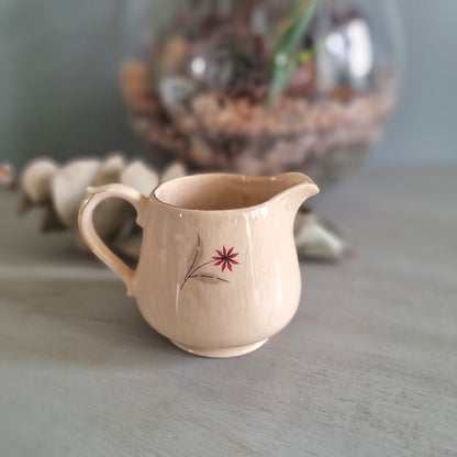 Vintage Crown Lynn New Zealand creamer jug with hand-painted starburst floral design