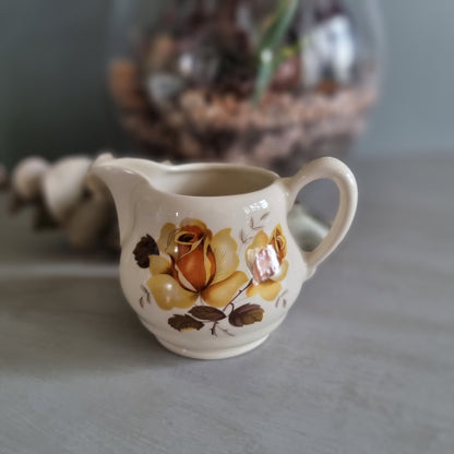 Vintage Cambridge ceramic creamer jug with golden rose design