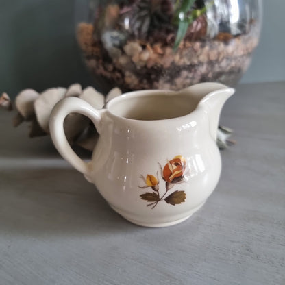 Vintage Cambridge ceramic creamer jug with golden rose design