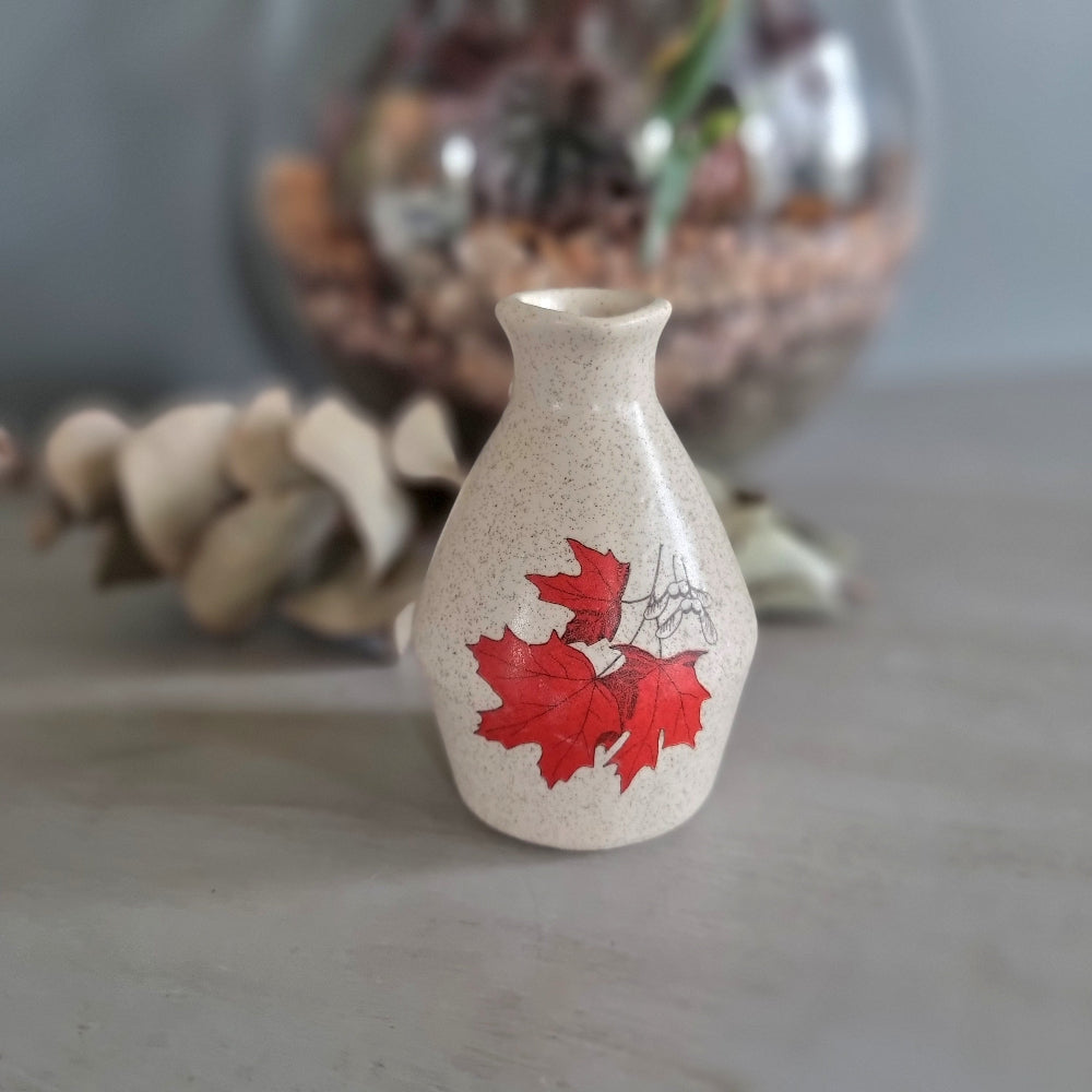 Vintage speckled cream ceramic jug with red maple leaf design