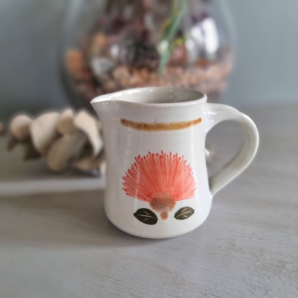 Vintage Kathy Palenski NZ studio pottery creamer jug with pōhutukawa flower design