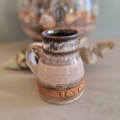Vintage stoneware mint sauce jug with handle and brown drip glaze