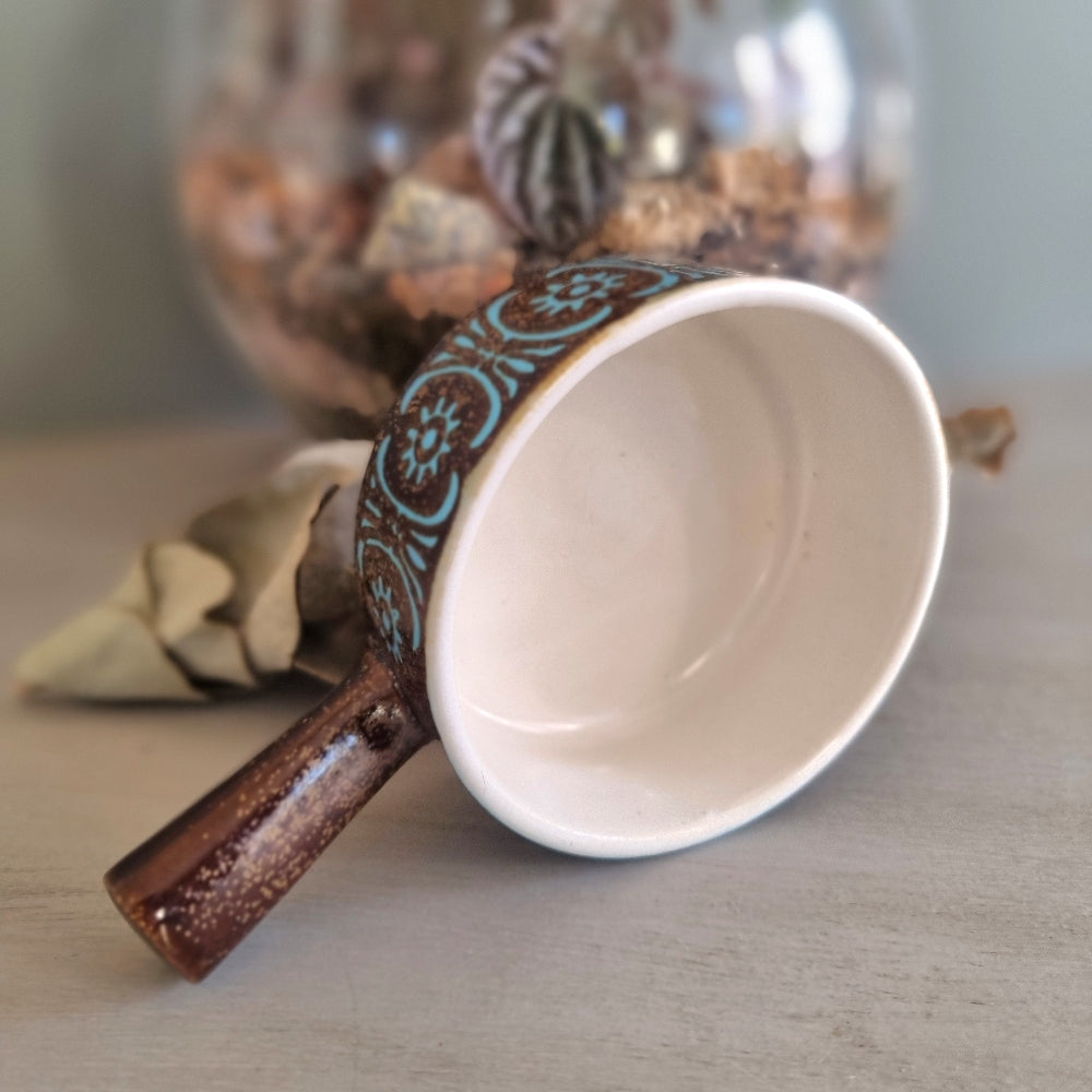 Retro brown and turquoise handled soup bowl with cream glazed interior