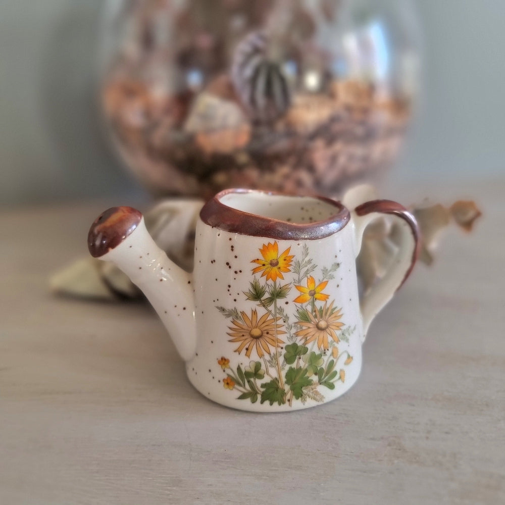 Vintage floral ceramic watering can made in Japan with orange daisy design