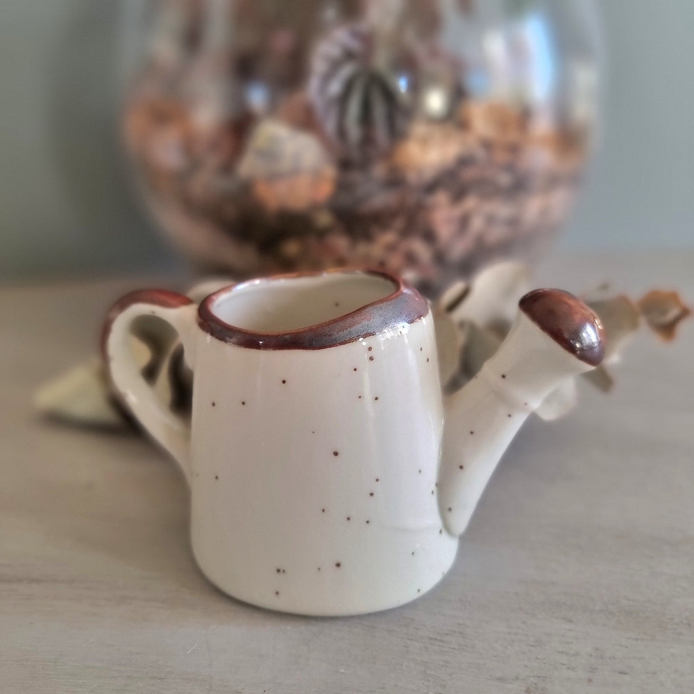 Vintage floral ceramic watering can made in Japan with orange daisy design