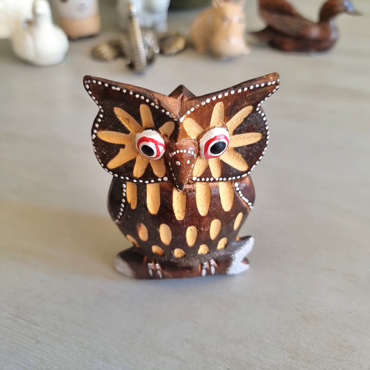 Hand painted carved wooden owl figurine with sunburst wing pattern