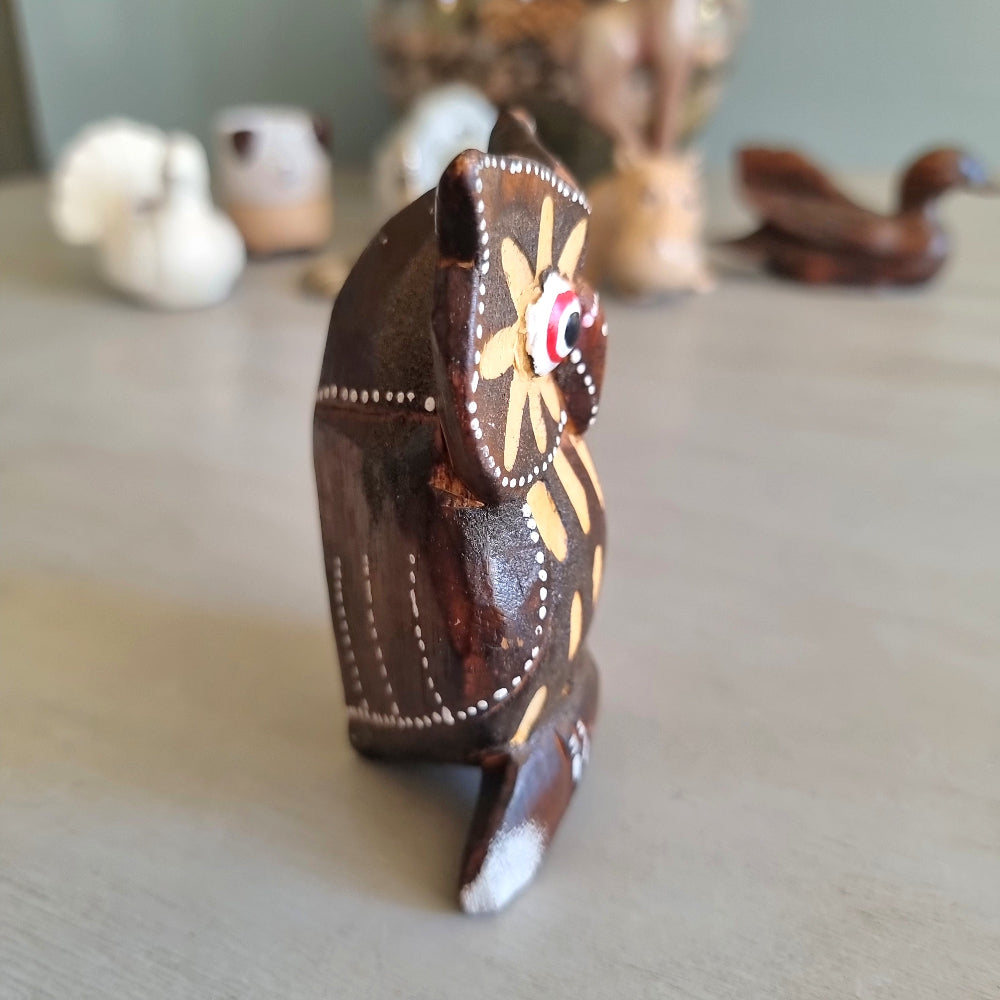 Hand painted carved wooden owl figurine with sunburst wing pattern