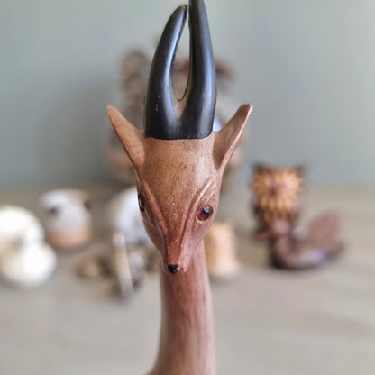 Tall mid century carved wood gazelle figurine with painted horns