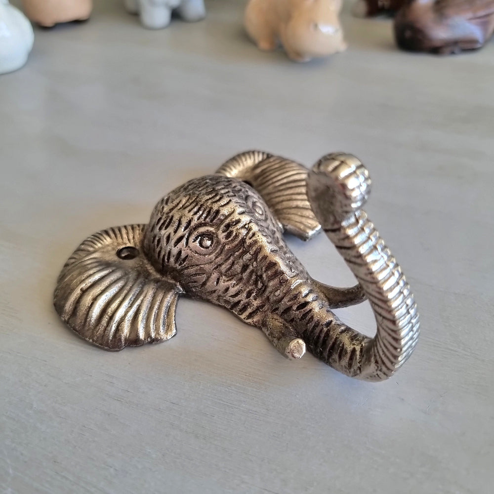 Silver-tone cast metal elephant head wall hook with textured detailing