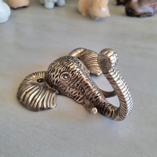 Silver-tone cast metal elephant head wall hook with textured detailing