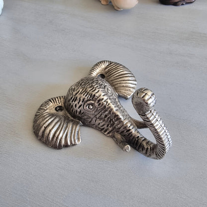 Silver-tone cast metal elephant head wall hook with textured detailing