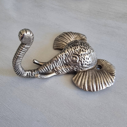 Silver-tone cast metal elephant head wall hook with textured detailing