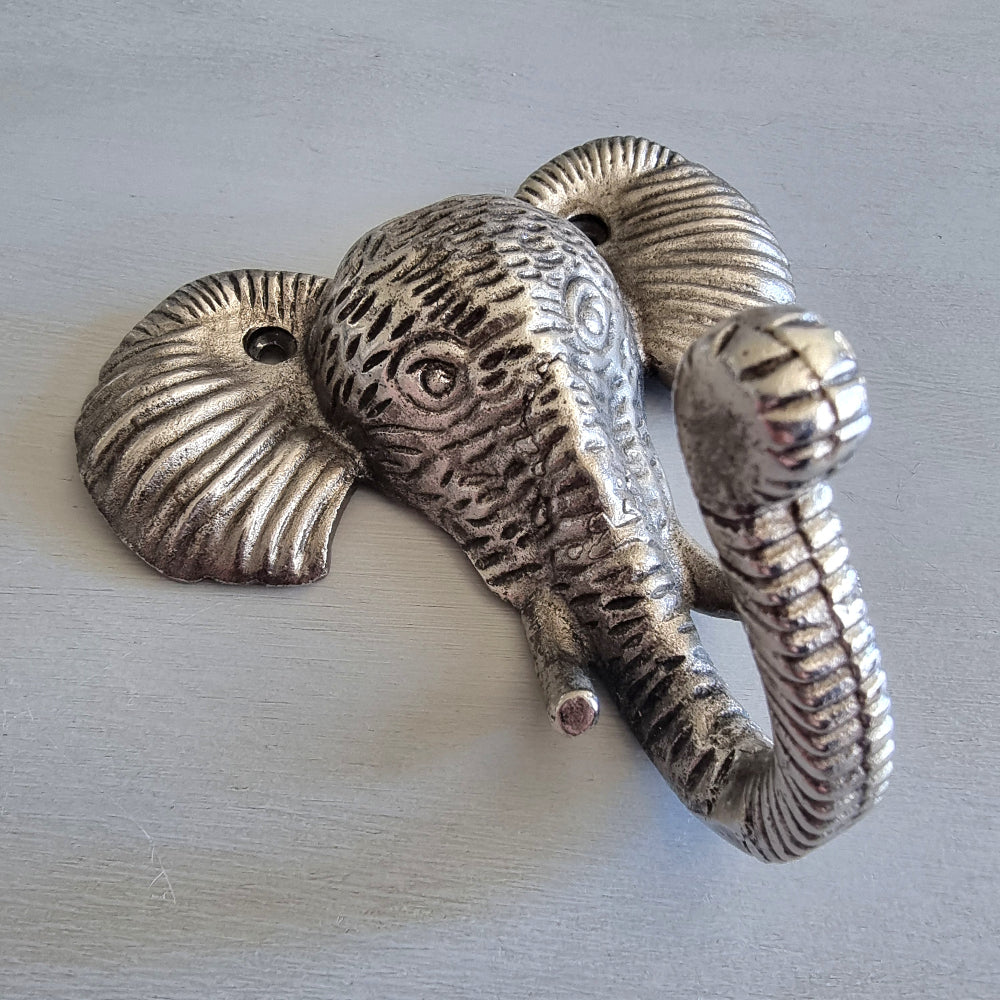 Silver-tone cast metal elephant head wall hook with textured detailing