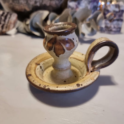 Handmade ceramic chamberstick candle holder by Ralph Hetzel, Sunshine Pottery Nelson. Cream glaze with brown drip detailing, stamped maker's mark to base.