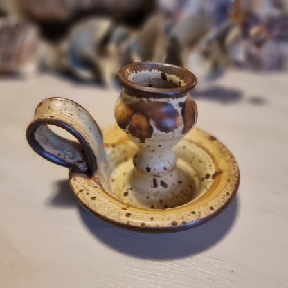Handmade ceramic chamberstick candle holder by Ralph Hetzel, Sunshine Pottery Nelson. Cream glaze with brown drip detailing, stamped maker's mark to base.