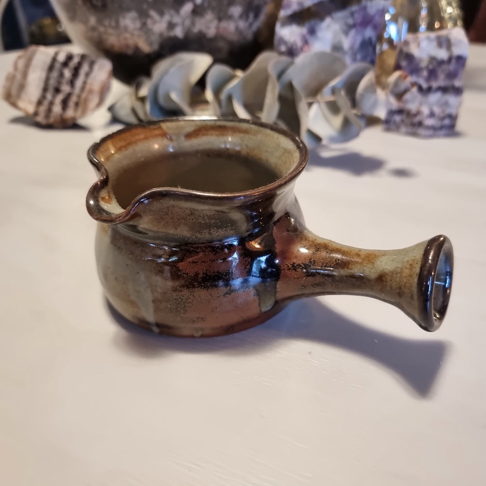 Norfolk Island studio pottery gravy jug with grey-blue glaze, abstract brushwork and rust-orange dots, stamped to base