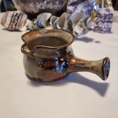 Norfolk Island studio pottery gravy jug with grey-blue glaze, abstract brushwork and rust-orange dots, stamped to base