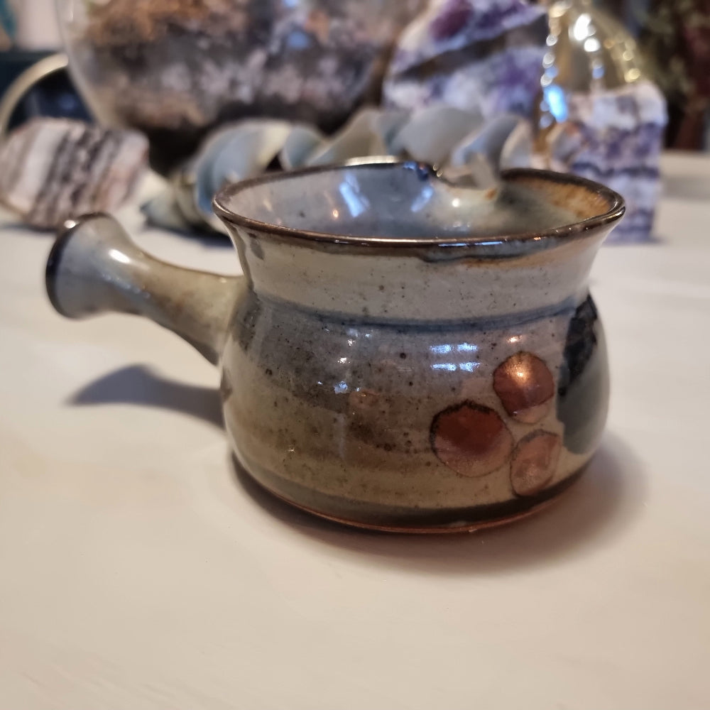 Norfolk Island studio pottery gravy jug with grey-blue glaze, abstract brushwork and rust-orange dots, stamped to base