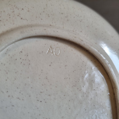 Vintage speckled oval dish with a transfer print of two swans and water lilies