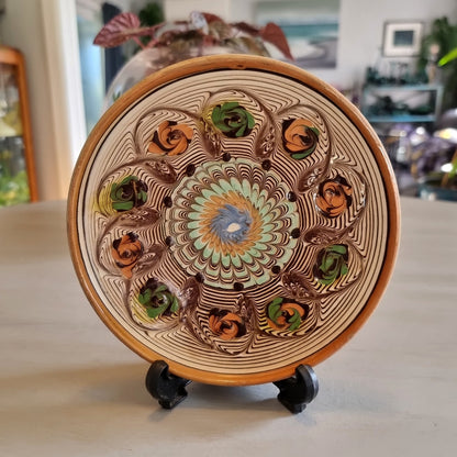 Horezu Romanian marbled clay dish with a swirled glaze and rose motifs