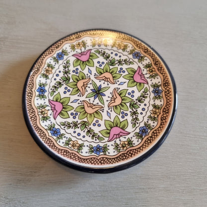 Small floral plate with a lattice edge design