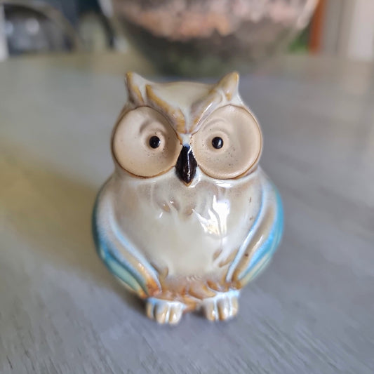 Small ceramic owl figurine with a teal drip glaze