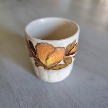 Vintage Palissy egg cup with a hand finished autumn floral design. 