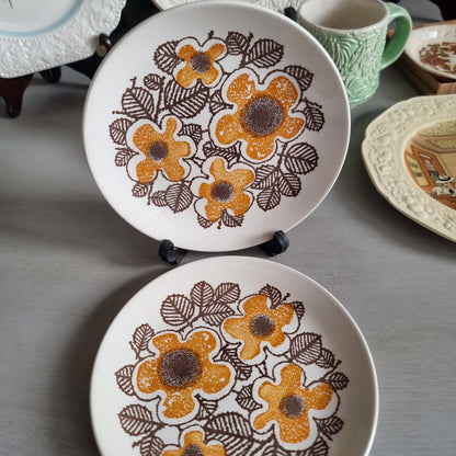 Two vintage Kelston Ceramics Virginia plates with orange speckled flowers and brown outlined leaves