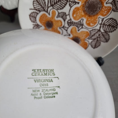 Two vintage Kelston Ceramics Virginia plates with orange speckled flowers and brown outlined leaves