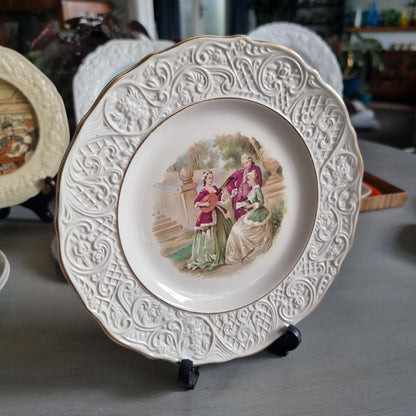 Vintage Solian Ware plate with a garden scene of three musicians in period costume and an embossed scroll border