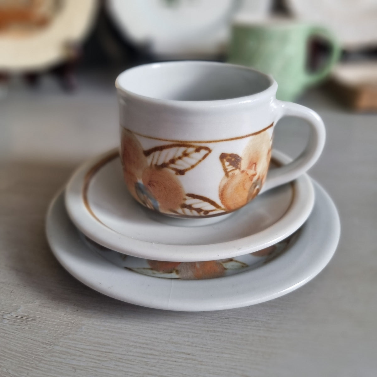 Vintage Kit Seator Wanganui stoneware cup, saucer and plate with orange flowers and brown banding