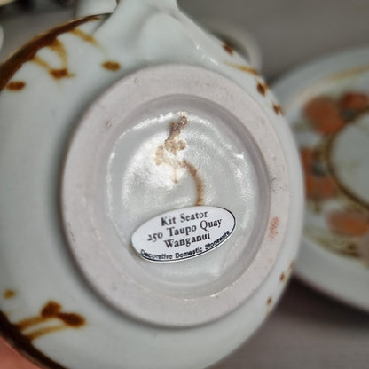 Vintage Kit Seator Wanganui stoneware cup, saucer and plate with orange flowers and brown banding