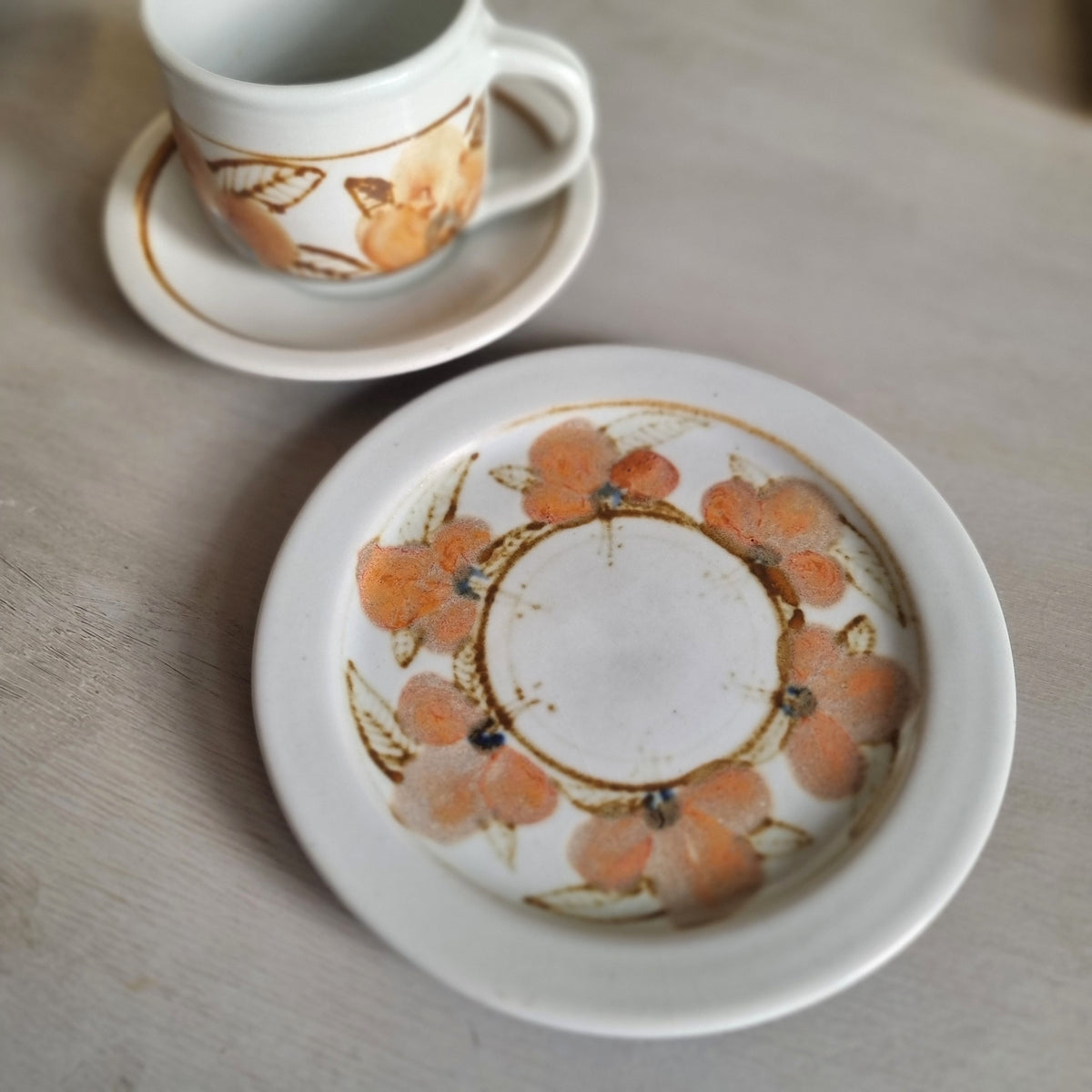 Vintage Kit Seator Wanganui stoneware cup, saucer and plate with orange flowers and brown banding