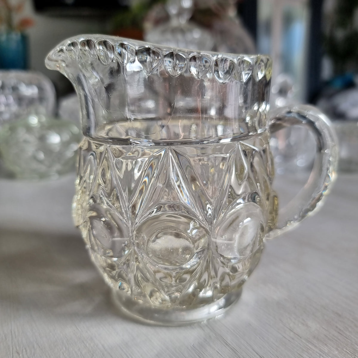 Vintage Bagley Empress pattern clear pressed glass cream jug with thumbprint and star panels and a beaded rim
