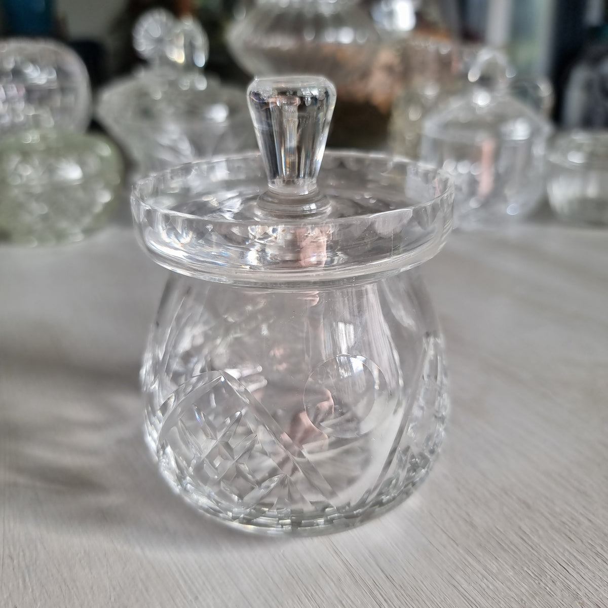 Vintage Webb Corbett cut crystal jam jar with cross hatch and fan cuts, flat scalloped lid and faceted knob