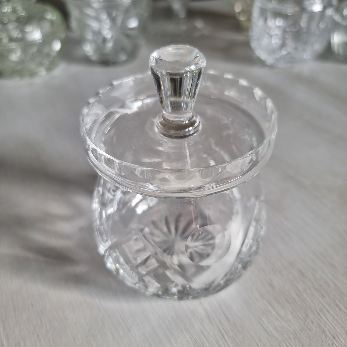Vintage Webb Corbett cut crystal jam jar with cross hatch and fan cuts, flat scalloped lid and faceted knob