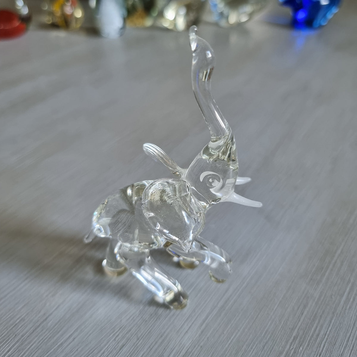 Vintage clear blown glass elephant figurine with trunk raised