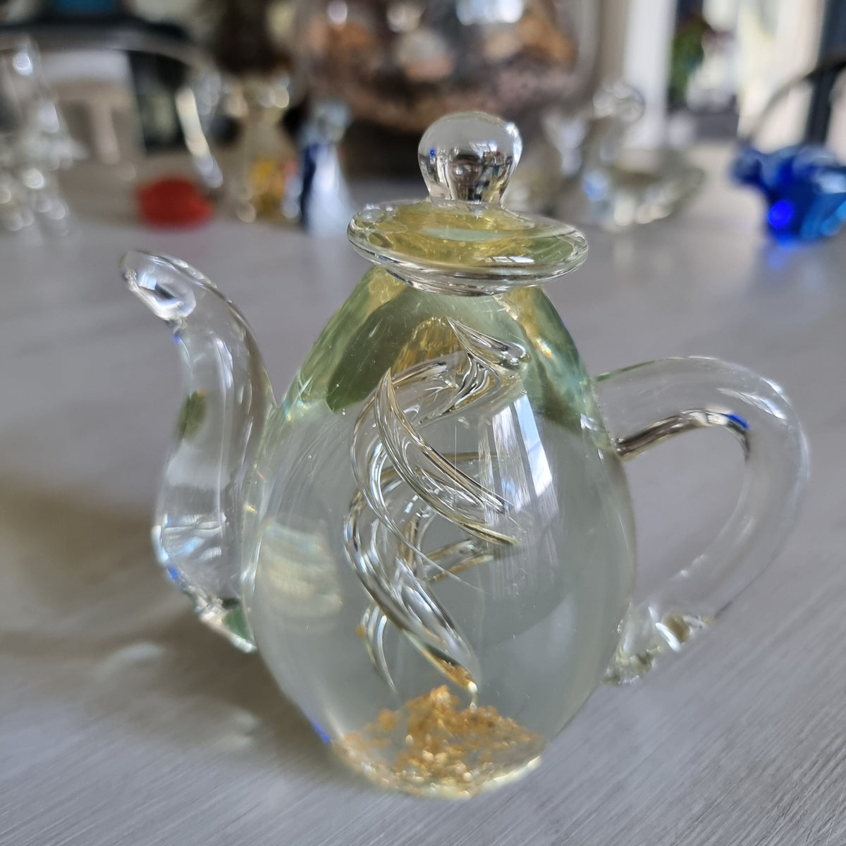 Vintage green-tinted blown glass teapot ornament with gold fleck detail